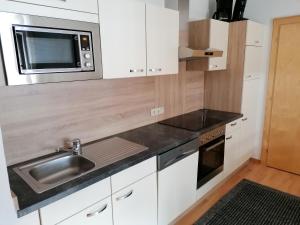 Kuchyň nebo kuchyňský kout v ubytování Apart Edi + 24 fotografií