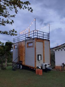 a tiny house with lights on top of it at Mini casa San Gil-Mogotes in San Gil