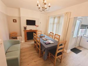a dining room with a table and chairs at The Bays in Bridlington