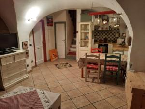 a kitchen and dining room with a table and a kitchen at Appartamento Sopramonte in Trento +15 photos