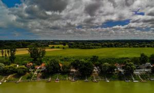 an aerial view of a river with boats at Futrinka Vendégház in Baja