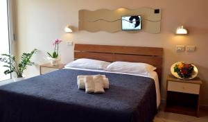 Postel nebo postele na pokoji v ubytování Hotel Oltremar B&B