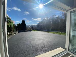 a view of a driveway through a door at Tanglewood Loft in Newry