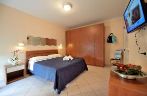 Postel nebo postele na pokoji v ubytování Hotel Oltremar B&B
