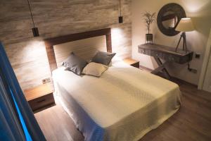 a bedroom with a bed and a table and a mirror at Burada in Baku +85 photos