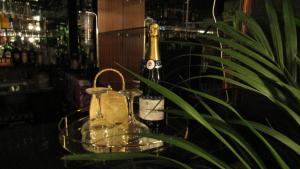 a glass tray with two glass jars and a champagne bottle at The Scala Hotel in Blackpool