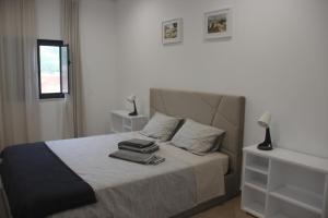 En eller flere senge i et værelse på Quinta do Sr. Cabrita