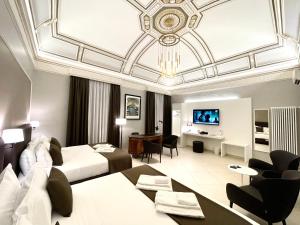 ETNEA STYLE CATANIA LUXURY ROOMS的电视和/或娱乐中心