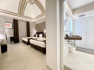 ETNEA STYLE CATANIA LUXURY ROOMS客房内的一张或多张床位
