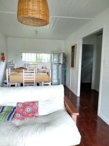 a living room with a white couch and a table at Los Sauces in Tigre