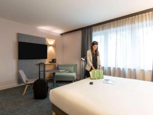 TV a/nebo společenská místnost v ubytování Novotel Brussels Centre Midi