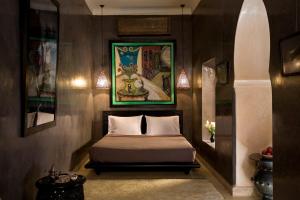 מיטה או מיטות בחדר ב-Riad Meriem