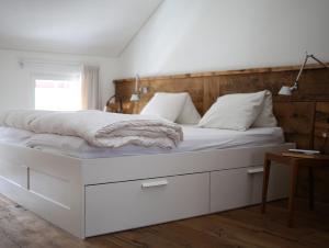 A bed or beds in a room at Chalet Swiss Andermatt