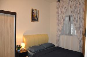 Postel nebo postele na pokoji v ubytování AmySity Homestay Gandaria Modern Lifestyle walking distance to Hub Shopping Centre at Sek 9 Bangi Sentral With Netflix