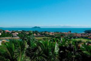 a view of the city and the ocean at Pousada Pelicano in Búzios