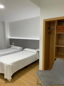 Posteľ alebo postele v izbe v ubytovaní Condedu