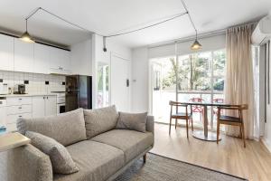 a living room with a couch and a table at Davis Avenue Apartments in Melbourne