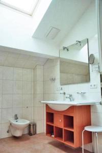 a bathroom with a sink and a mirror at Residenz-Ostseestrand-Wohnung-30-337 in Kühlungsborn