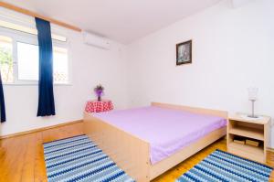 Postel nebo postele na pokoji v ubytování Apartments Rašica Molunat