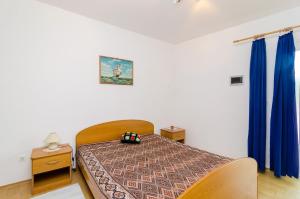 Postel nebo postele na pokoji v ubytování Apartments Rašica Molunat