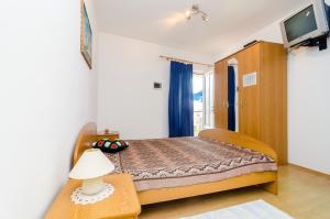Postel nebo postele na pokoji v ubytování Apartments Rašica Molunat