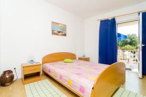 Postel nebo postele na pokoji v ubytování Apartments Rašica Molunat