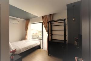 Postel nebo postele na pokoji v ubytování Maison Khoi Homestay