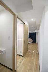 an empty hallway with a sliding door and a table at Uhome千駄木静雅民宿旅馆 in Tokyo