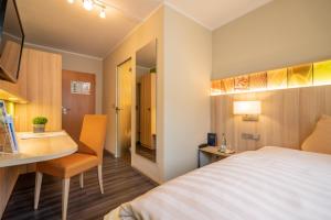 Postel nebo postele na pokoji v ubytování Hotel-Gasthaus Adler