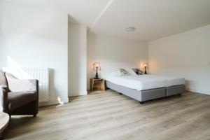 Un pat sau paturi într-o cameră la Appartement in Zeeland - Kabbelaarsbank 2D - Port Marina Zélande - Ouddorp