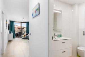 a white bathroom with a sink and a toilet at MODERN APARTMENTS LOS CRISTIANOS CENTER in Los Cristianos