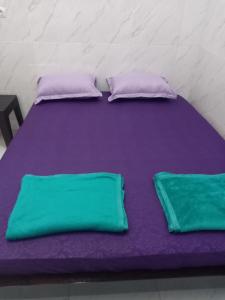 Postel nebo postele na pokoji v ubytování Homestay 89 New