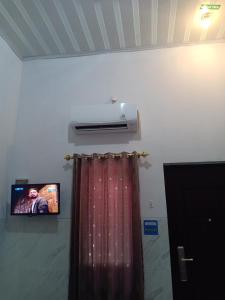 TV a/nebo společenská místnost v ubytování Homestay 89 New