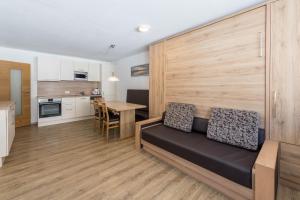 a living room with a couch and a table at Haus Kreidl - Top 31 in Königsleiten