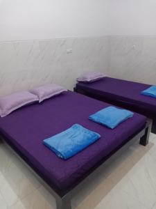 Postel nebo postele na pokoji v ubytování Homestay 89 New