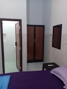 Postel nebo postele na pokoji v ubytování Homestay 89 New