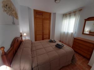 Postel nebo postele na pokoji v ubytování ALOJAMIENTO LA TERRAZA DE LUIS