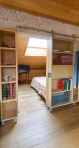 a bedroom with a bunk bed and a bed with books at Hotel Daniel in Pescasseroli