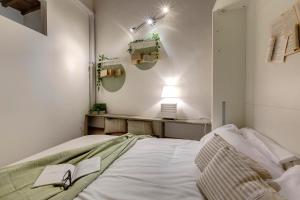 A bed or beds in a room at Vinegia N5 - Clemente & Settimo Apartments