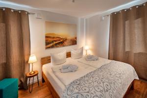 Кровать или кровати в номере Strandland