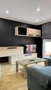 A bed or beds in a room at PiyMargall2 By Vigovacaciones