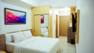 Łóżko lub łóżka w pokoju w obiekcie Cordova Suites