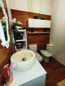 a bathroom with a sink and a toilet at Mermaid House- pareado boutique - playa a 200m- pases para piscina externa in Chiclana de la Frontera