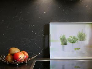 a picture of a basket of apples and plants at Ferienhaus Dorfleben in Vogtsburg