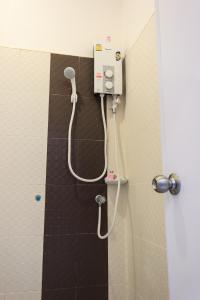 a shower in a bathroom with a shower at ST Mansion in Khanom