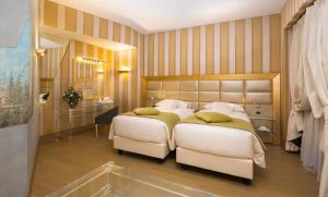 Giường trong phòng chung tại c-hotels Rubens