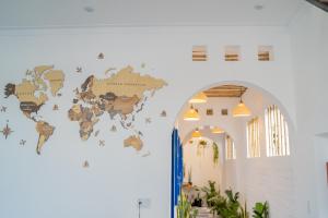 a map of the world on the wall of a building at Cube homestay Phan Rang cách biển 300m to the beach in Phan Rang