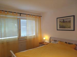 Ein Bett oder Betten in einem Zimmer der Unterkunft Ferienwohnung Engelsberg