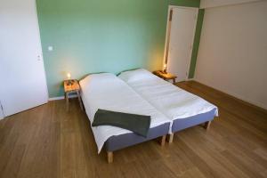 a hospital room with a bed with white sheets at Villa-am Wasser- Wellness-NationaalPark- in Earnewâld