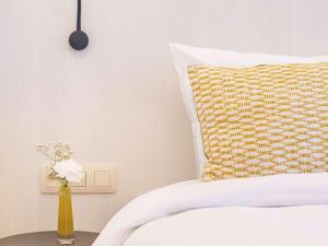 Кровать или кровати в номере Mercure Oostende